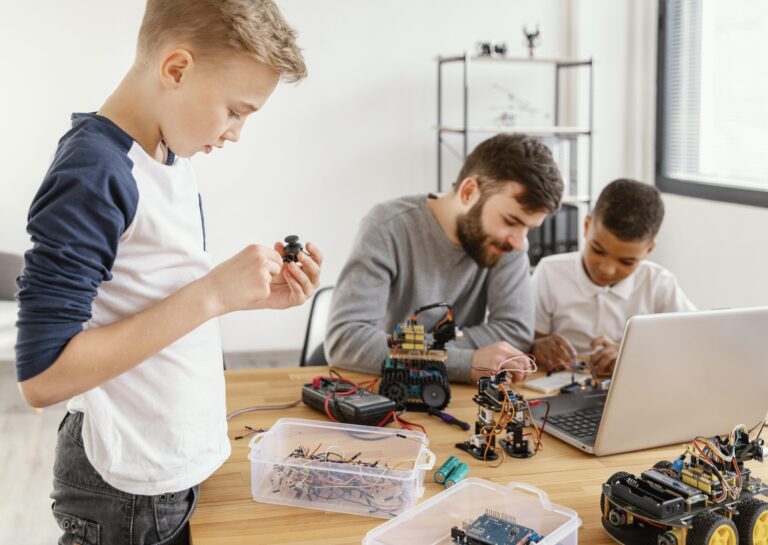 father-sons-making-robot